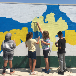 students painting wall